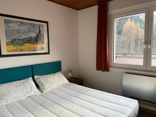 Postel nebo postele na pokoji v ubytování Appartamenti Vacanze Casa Marilleva