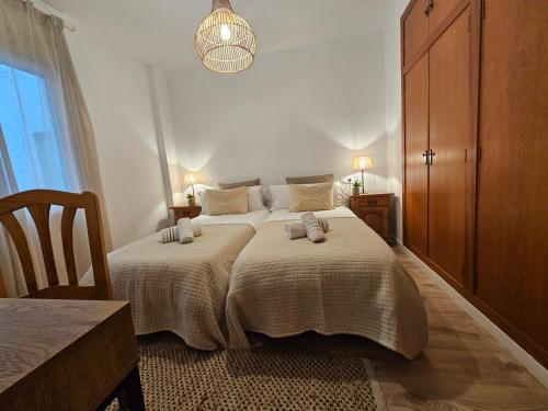 Ένα ή περισσότερα κρεβάτια σε δωμάτιο στο Adumar, apartamento renovado en el puerto de Jávea