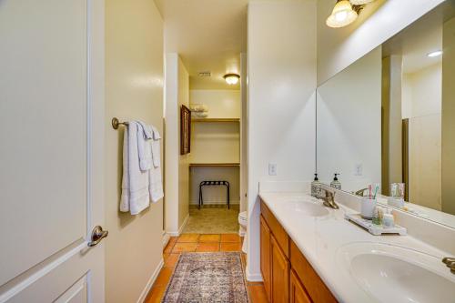 a bathroom with a sink and a mirror at Sunny Adobe Retreat with Hot Tub and Mtn Views! in Tubac