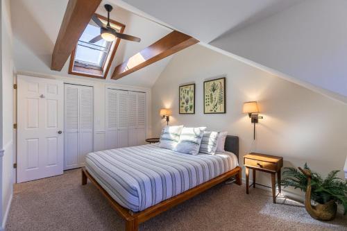 a bedroom with a bed and a skylight at Chetola: Chestnut 8 in Blowing Rock
