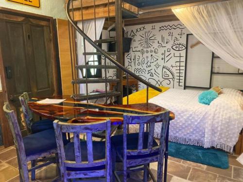 a room with a table and chairs and a bed at Go Glamping in Athens, Georgia, in this Cozy Tiny House for Four in Athens