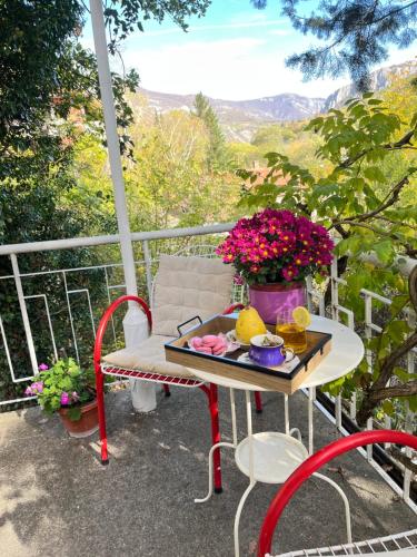a table with a tray of food on a balcony at Viva Sićevo 