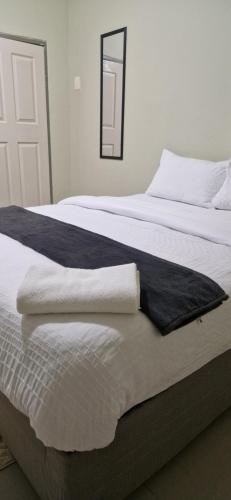 Ένα ή περισσότερα κρεβάτια σε δωμάτιο στο IJ Apartments