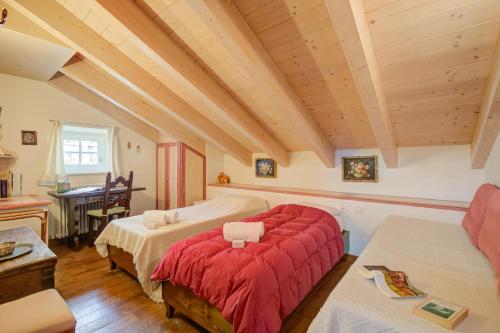Ένα ή περισσότερα κρεβάτια σε δωμάτιο στο Antico Chalet Livigno