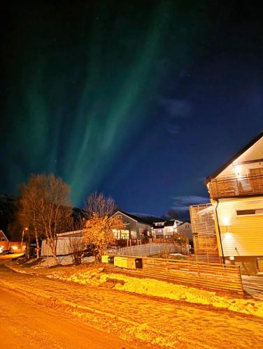 an image of the northern lights in the sky at Aurora View Apartment - Free Parking & Walkable City Location in Tromsø