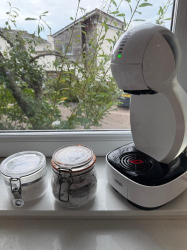 a mixer sitting on a counter next to a window at Portishead Coastal Retreat in Portishead