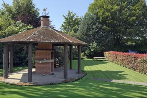 a gazebo in the middle of a lawn at Résidence Rachel 12 in Mons