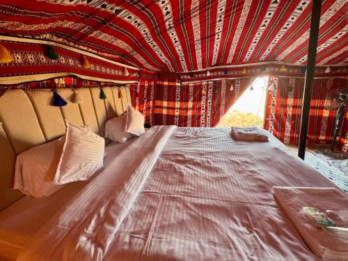 a bed in the back of a bus at layali camp in Bidiyah