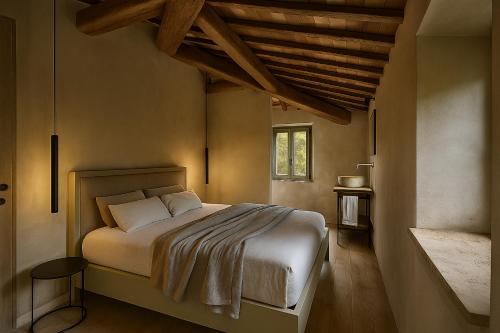 En eller flere senge i et værelse på Villa Petroio - Luxury Home with Private Pool