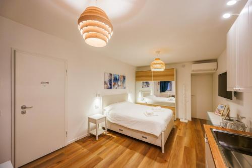 Postel nebo postele na pokoji v ubytování BGY Maison del Borgo 2