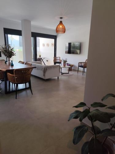 a living room with a couch and a table at Αriadne in Porto Rafti