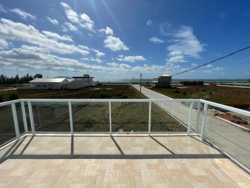 a view from the top of a balcony of a house at Ventos de Arubinha in Arraial do Cabo