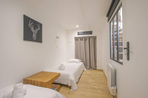 Ένα ή περισσότερα κρεβάτια σε δωμάτιο στο Duplex centre historique de Bayeux