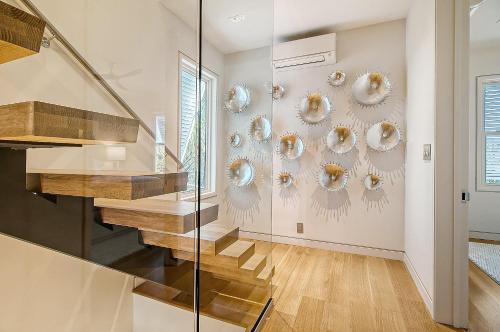 a staircase in a house with a glass wall at GP58: 58 Grand Pavilion in Isle of Palms