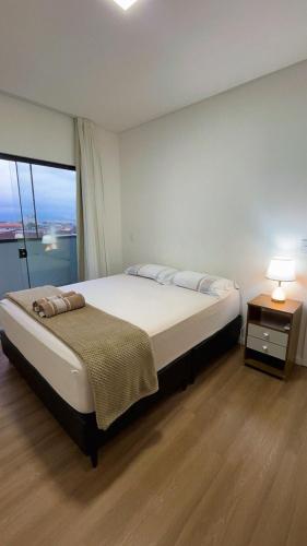 Ένα ή περισσότερα κρεβάτια σε δωμάτιο στο Apartamento Modernizado