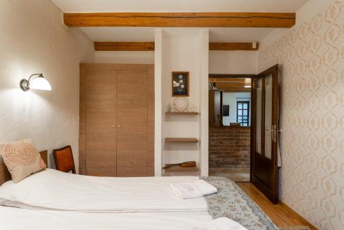 Ένα ή περισσότερα κρεβάτια σε δωμάτιο στο Kicsi Gólya 1