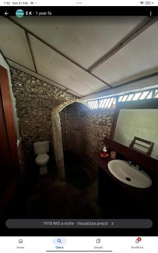 a bathroom with a sink and a toilet at La Princesa de La Isla in Big Corn Island