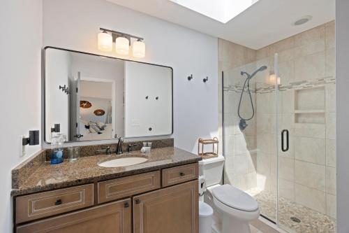 a bathroom with a sink and a toilet and a shower at SWL1133: 1133 Summerwind Lane in Seabrook Island
