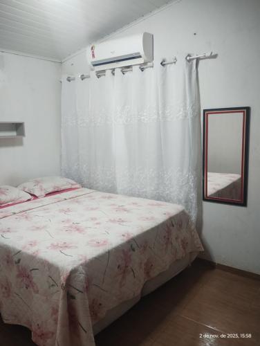 En eller flere senge i et værelse på casa climatizada lateral da br