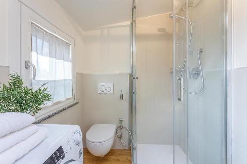 a bathroom with a shower and a toilet at Corso Adriano 13 - La Torre in Modena