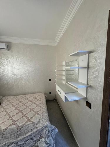 Ένα ή περισσότερα κρεβάτια σε δωμάτιο στο Appartement