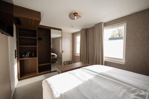 Postel nebo postele na pokoji v ubytování Boutique Hotel de Zeuve Meeren