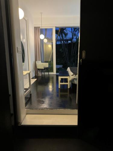 a room with a view of a living room at Serenity Room at Villa Love in Seminyak