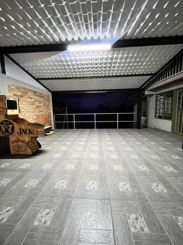 a large room with a wooden floor and a ceiling at Villa Verde in Popayan