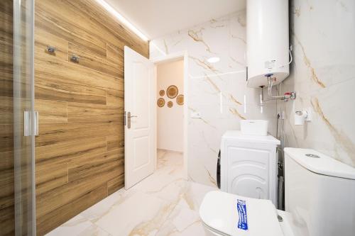 a bathroom with a toilet and a sink at Skyview Apartment in Adeje