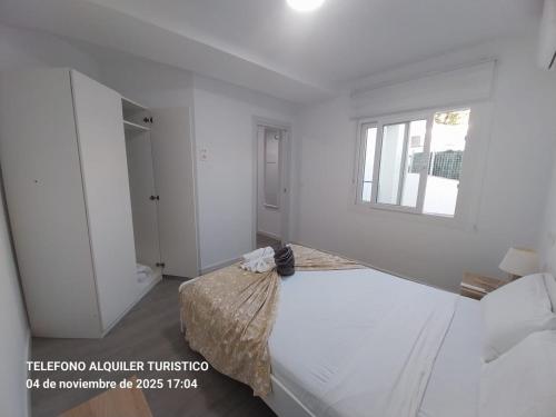 Een bed of bedden in een kamer bij Apartamento 2 habitaciones con Terraza Malaga