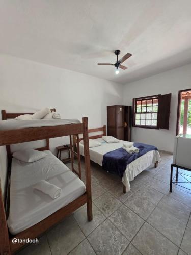 Ένα ή περισσότερα κρεβάτια σε δωμάτιο στο Pousada São José da Serra