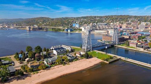 an aerial view of a bridge over a river at Dragestil 713 Duluth Luxury Condos by Heirloom Boutique Collection in Duluth