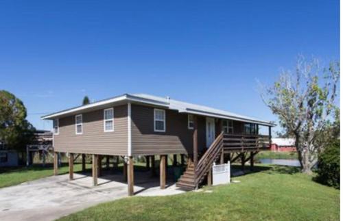 a large house with a large porch and a deck at Peace on the River, Breathtaking Views in Cocoa