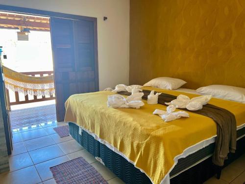 Postel nebo postele na pokoji v ubytování Pousada Recanto Guará