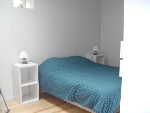 Ένα ή περισσότερα κρεβάτια σε δωμάτιο στο Aux vieux fours 4 chambres 2 salle d'eau