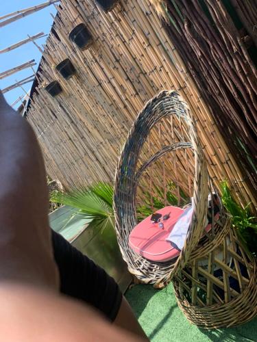 a person is looking down at two wicker baskets at Ewakanda Backpackers in Vereeniging