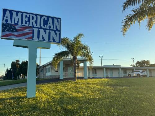 an american inn sign in front of a building at American Inn in Cocoa