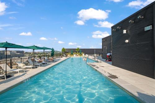 a swimming pool on the roof of a building at Bluebird Suites at Capitol Hill in Washington, D.C.