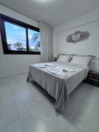 Postel nebo postele na pokoji v ubytování Residencial Enseada Praia do Forte Apto 130