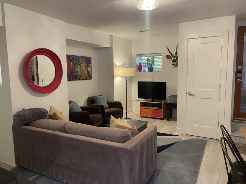 a living room with a couch and a television at Charming 2BD1BA in Hip Area - Near Metro in Washington, D.C.