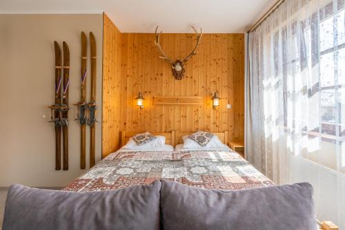 Ένα ή περισσότερα κρεβάτια σε δωμάτιο στο Apartman Hubert