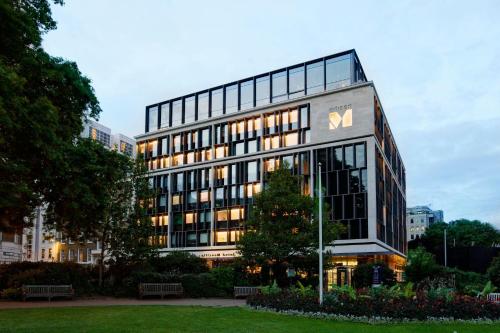 a large building with a sign in front of it at citizenM Tower of London in London