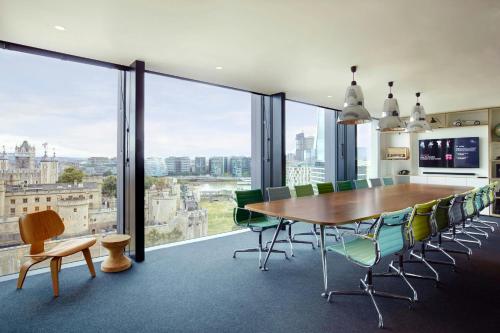 a dining room with a table and chairs at citizenM Tower of London in London
