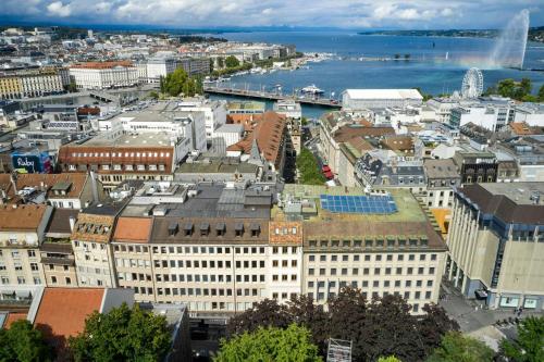 an aerial view of a city with a harbor at citizenM Geneva in Geneva
