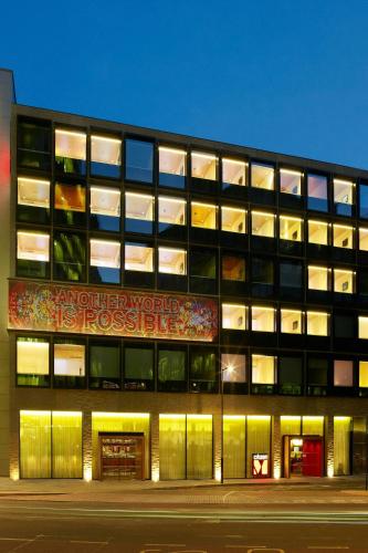 a building with a sign on the side of it at citizenM London Bankside in London