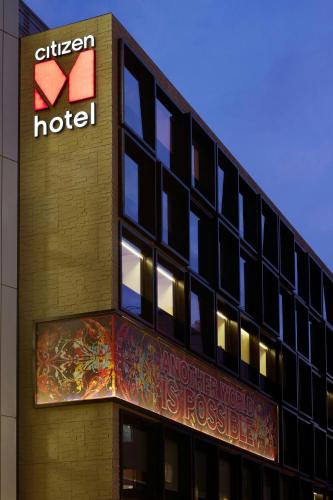 a hotel with a sign on the side of a building at citizenM London Bankside in London