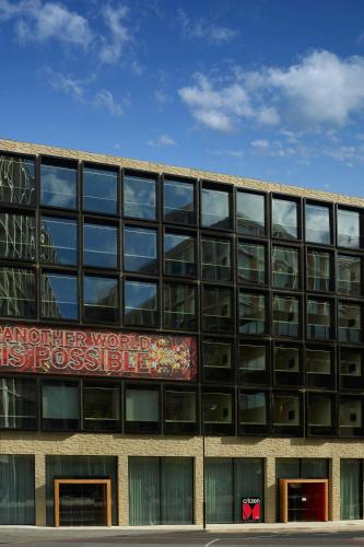 a building with a sign on the side of it at citizenM London Bankside in London