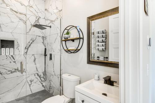 a bathroom with a shower and a toilet and a sink at Romantic Mountain Retreat with Scenic Views! in Idaho Springs