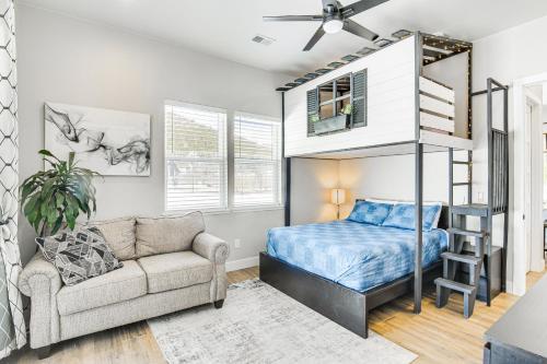 a bedroom with a bunk bed and a couch at Romantic Mountain Retreat with Scenic Views! in Idaho Springs