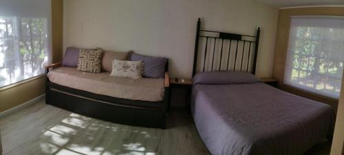 Ein Bett oder Betten in einem Zimmer der Unterkunft La Comarca Tinyhouse Monoambiente